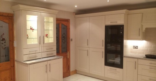 Kitchen with custom built pantry in cream