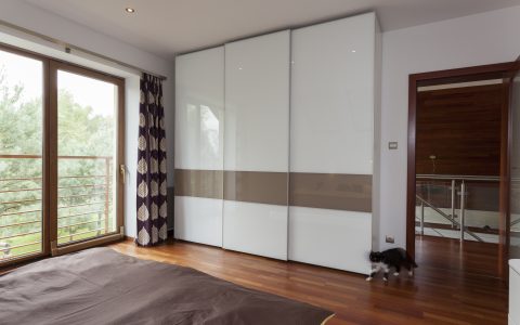 Wardrobe with high gloss sliding doors