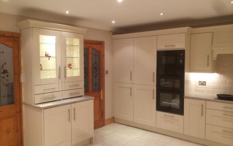 Kitchen with custom built pantry in cream