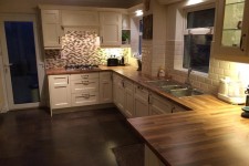 Cream shaker style kitchen with walnut worktop