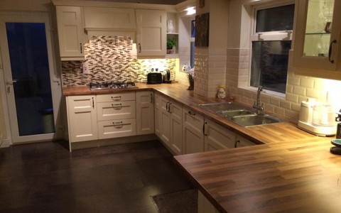 Cream shaker style kitchen with walnut worktop