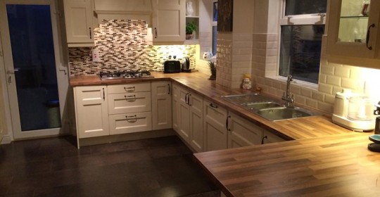 Cream shaker style kitchen with walnut worktop
