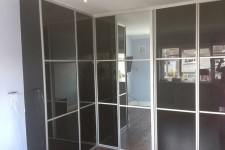 Custom built high gloss wardrobe with sliding doors